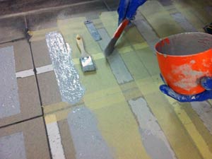 Application of Belzona 5231 with additional aggregate incorporated onto fish market floor