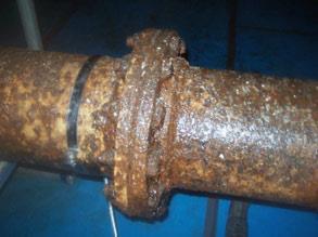 Corroded gas pipes at a food production plant with constant surface condensate