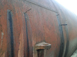 Wooden pegs plug leaking fatty acid tank